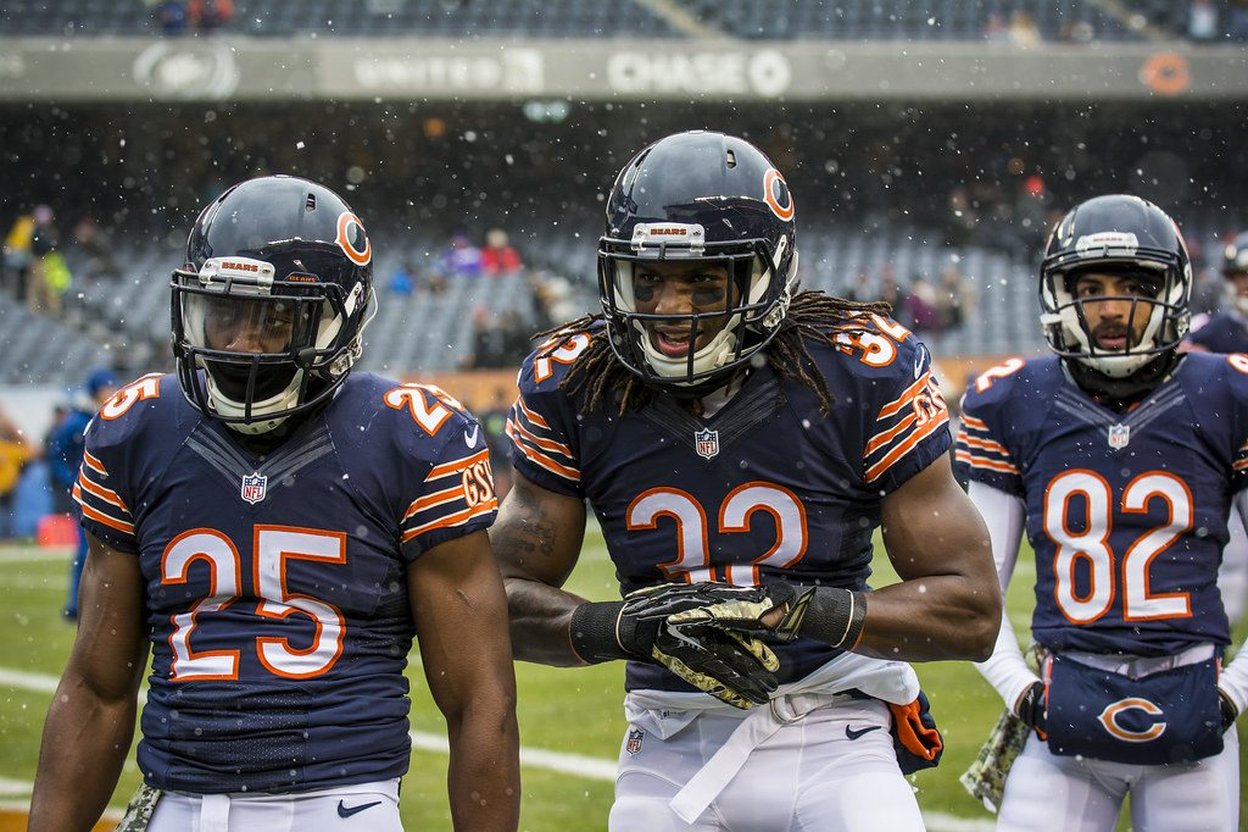 Chicago Bears players on field in snowy weather, numbers 25, 22, and 82 visible.