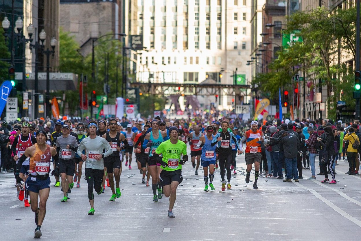Runners filling a downtown Chicago street during the 2019 Chicago Marathon