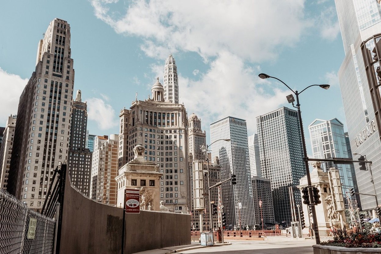 Chicago skyscrapers under a partly cloudy sky.