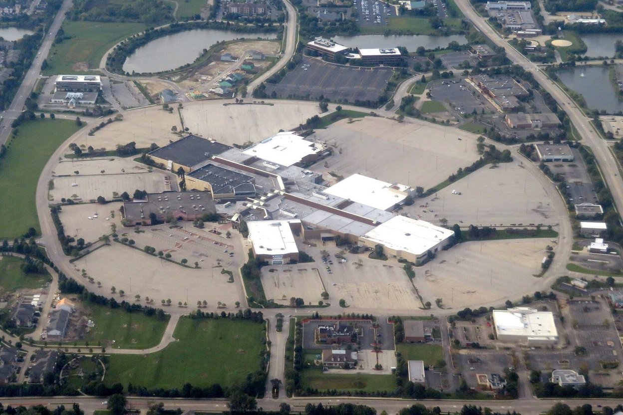Torn-up ground and construction equipment on the former Stratford Square mall site in Bloomingdale, with the Kohl's store still standing