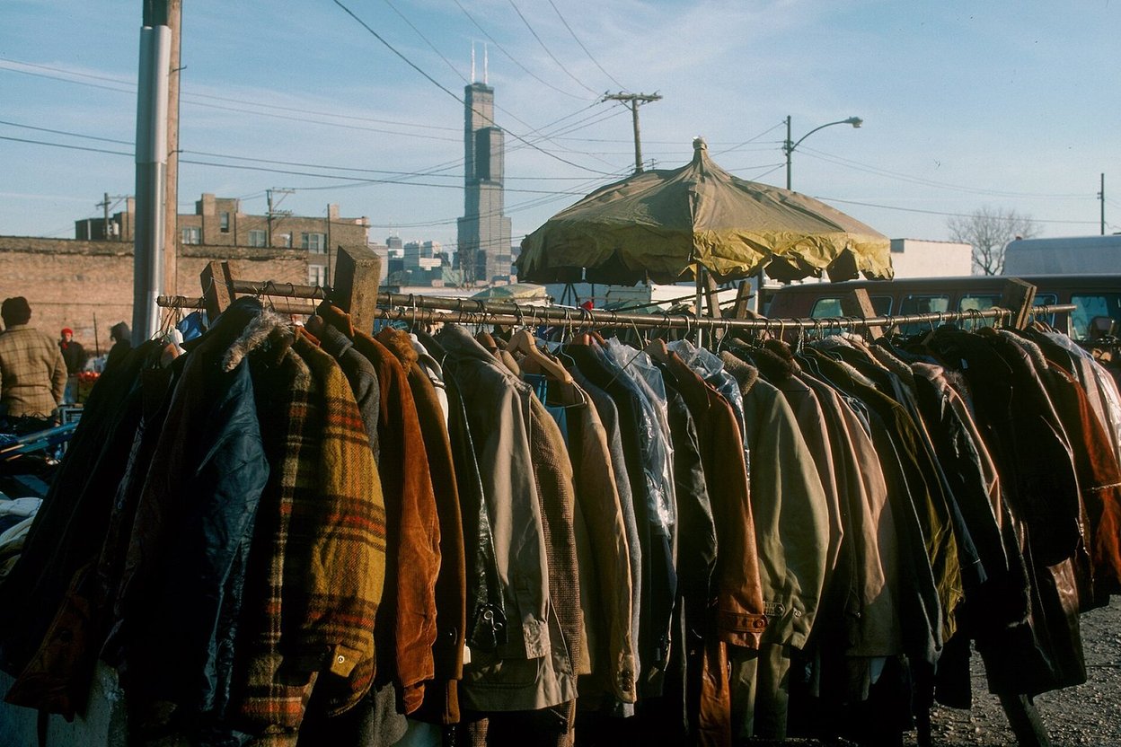 A crowded open-air street market on Maxwell Street in Chicago