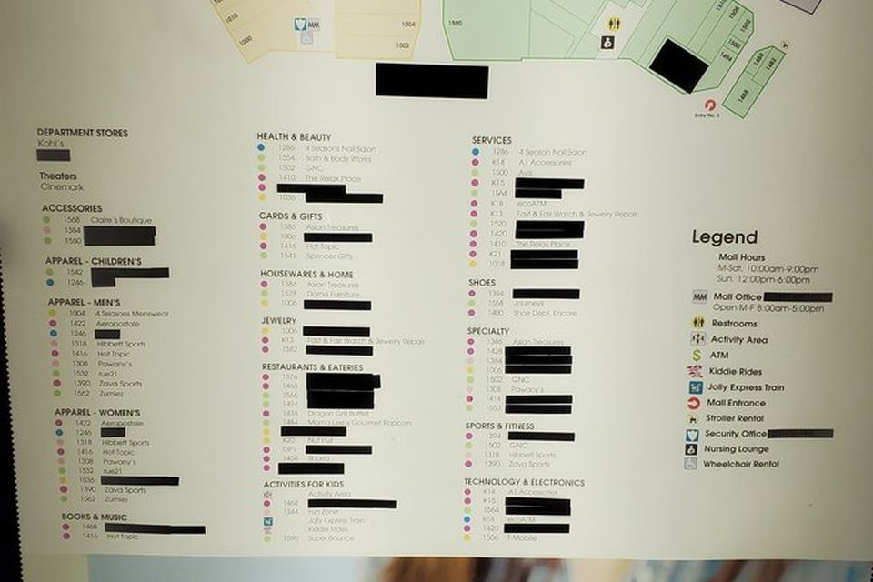 The store list on the same Spring Hill directory, with the names of closed stores covered in black